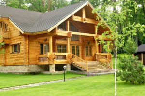 Two Story Wood Log Cabin with a Large Porch